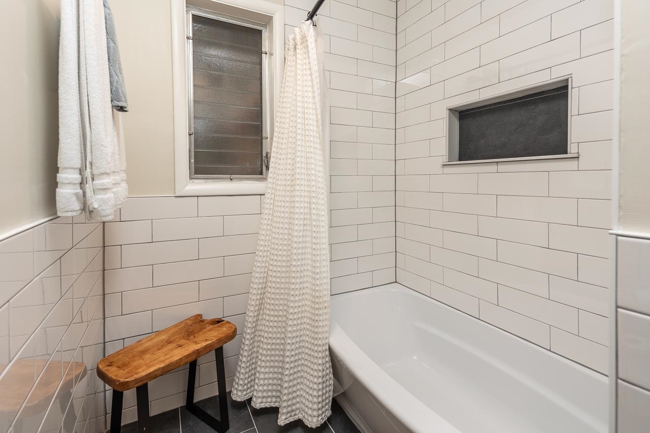 5641 Normandy Road Memphis, TN 38120 - Photo 20 of 25 a bathroom with a toilet a sink and mirror