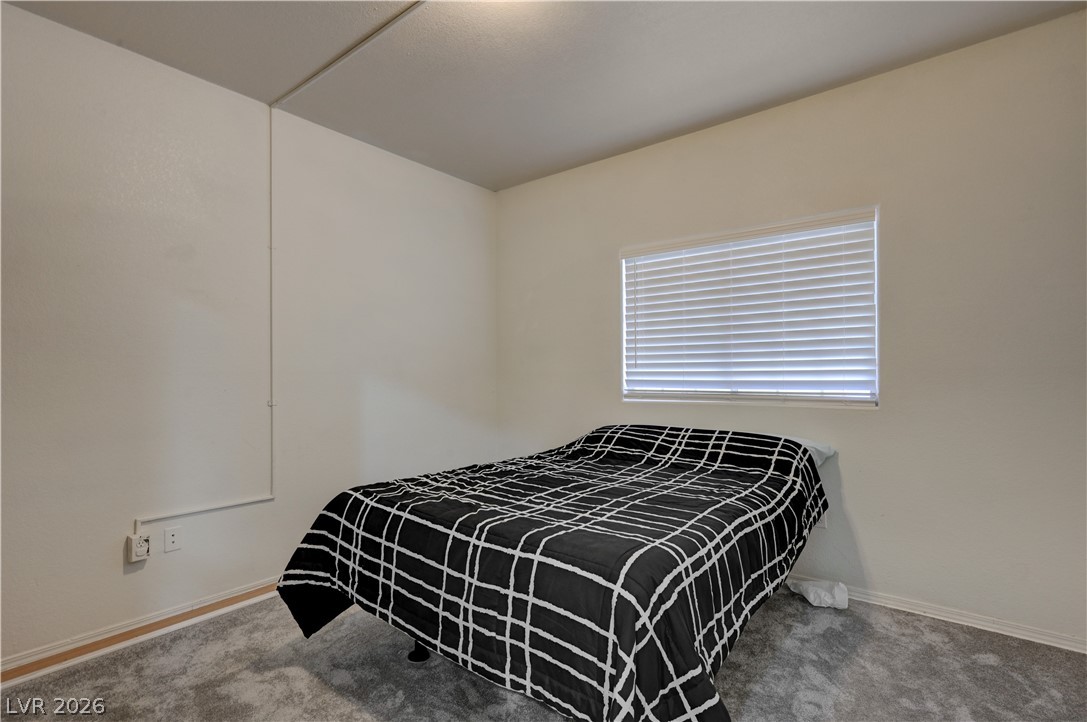 4730 East Craig Road, Unit 1155 Las Vegas, NV 89115 - Photo 17 of 41 A well-lit bedroom provides comfortable living with soft carpeting and a window for natural light.