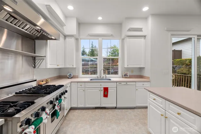 a very nice looking dining room with a large window