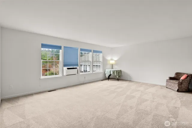 a bathroom with a tub a sink and mirror