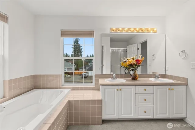 a bedroom with two beds and a window