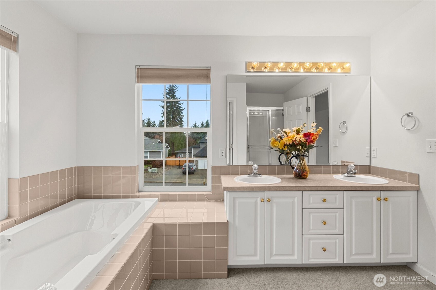 2312 Carnbee Court Southeast Lacey, WA 98513 - Photo 25 of 37 a bathroom with a tub a sink and mirror