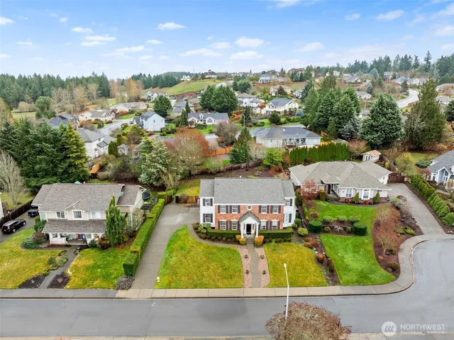 an aerial view of a house with a swimming pool