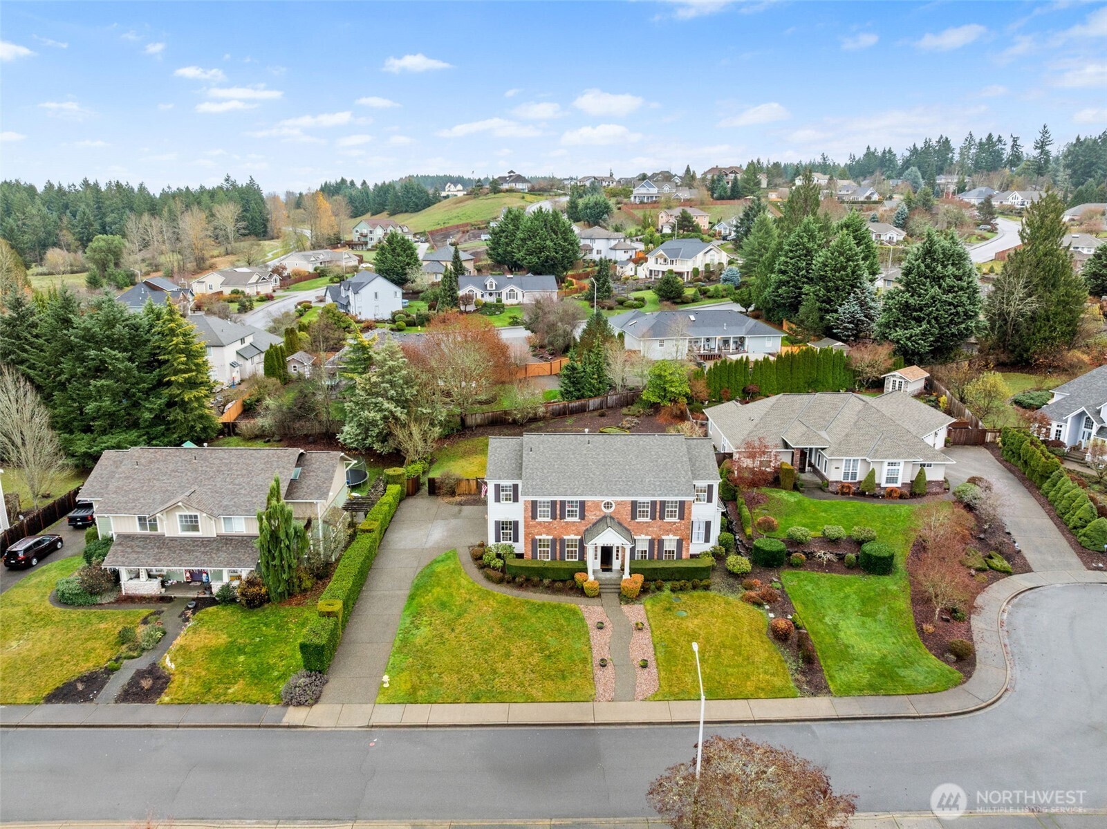 2312 Carnbee Court Southeast Lacey, WA 98513 - Photo 3 of 37 an aerial view of a house with a swimming pool