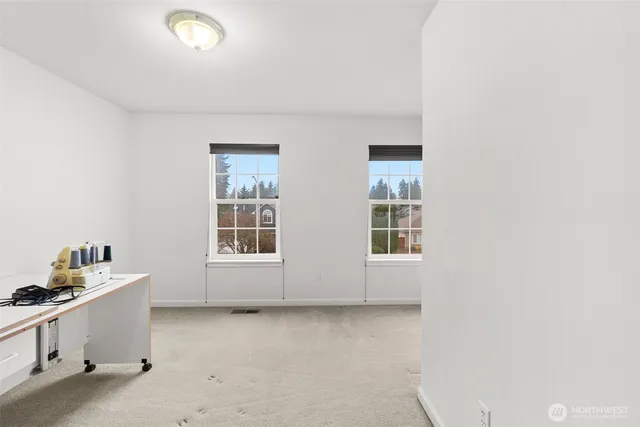 a view of a patio with table and chairs with wooden floor and fence