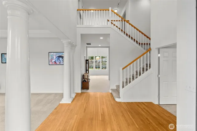 a view of entryway with wooden floor