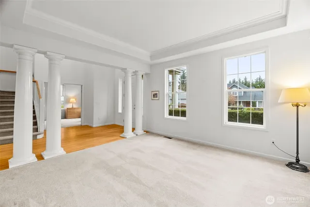 a living room with furniture and windows