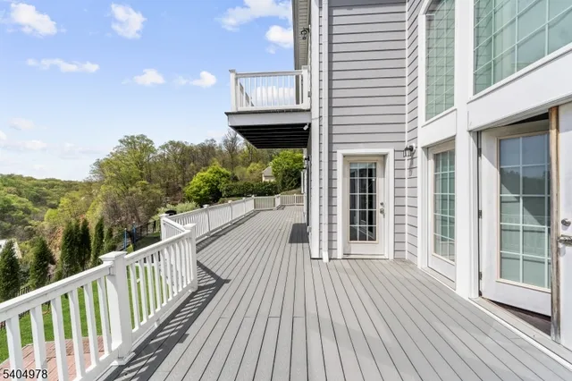 a view of a house with porch and wooden floor
