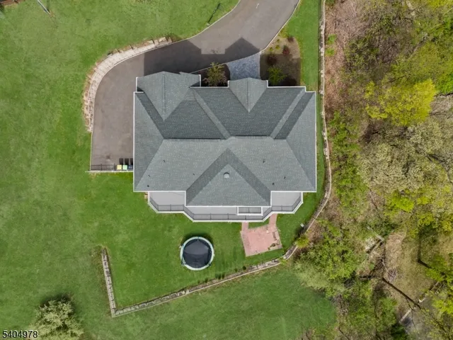 an aerial view of a house with yard