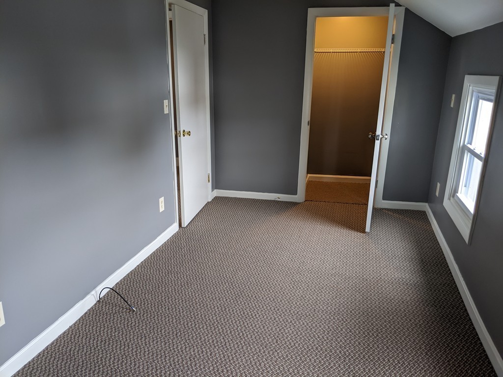 655 Grinnell Street Fall River, MA 02721 - Photo 18 of 24 an empty room with windows