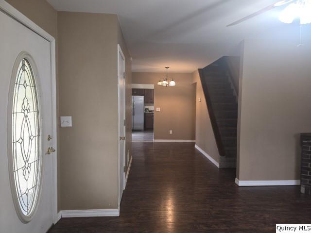 303 North Washington Street Carthage, IL 62321 - Photo 7 of 25 a view of a hallway with wooden floor and windows