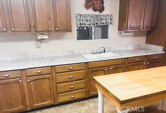 a kitchen with a sink and cabinets