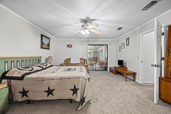 1816 Caddo Peak Road Joshua, TX 76058 - Photo 19 of 38 a bed room with a bed and a chandelier