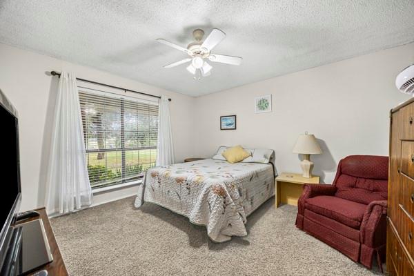 1816 Caddo Peak Road Joshua, TX 76058 - Photo 21 of 38 a bedroom with a bed and a couch