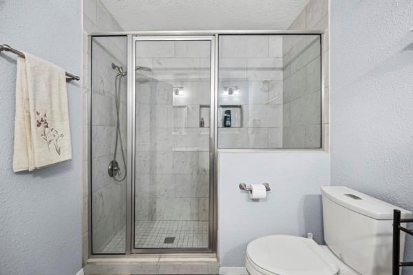 1816 Caddo Peak Road Joshua, TX 76058 - Photo 23 of 38 a bathroom with a shower and toilet