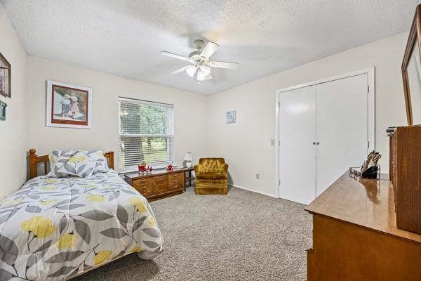 1816 Caddo Peak Road Joshua, TX 76058 - Photo 24 of 38 a bedroom with a bed and a chandelier