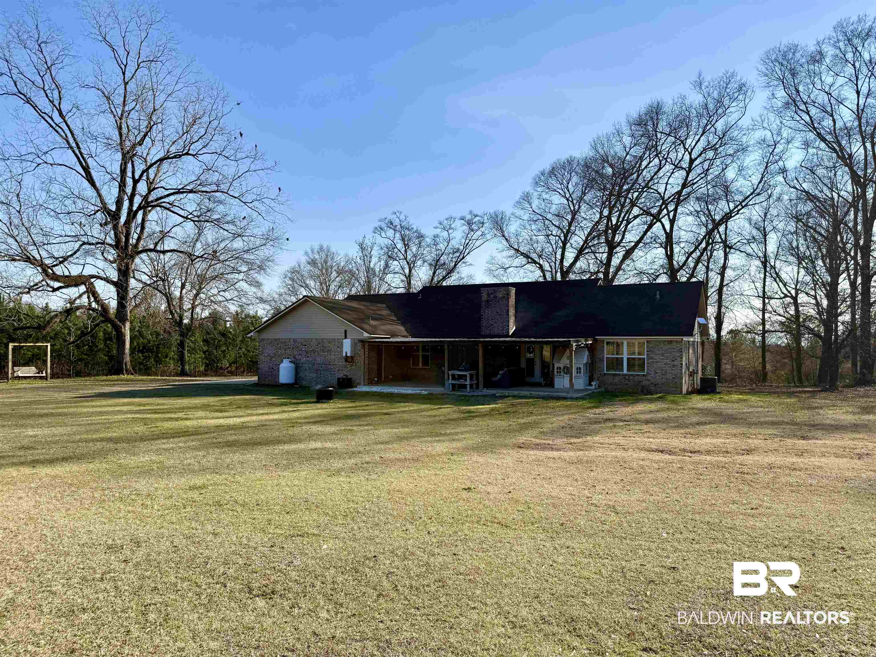 5646 Foshee Road Brewton, AL 36426 - Photo 33 of 37 View of front of house featuring a patio and a front yard