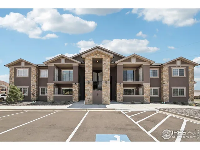 an aerial view of a house with a ocean view