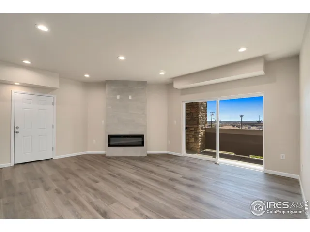 a kitchen with kitchen island granite countertop stainless steel appliances refrigerator sink and microwave