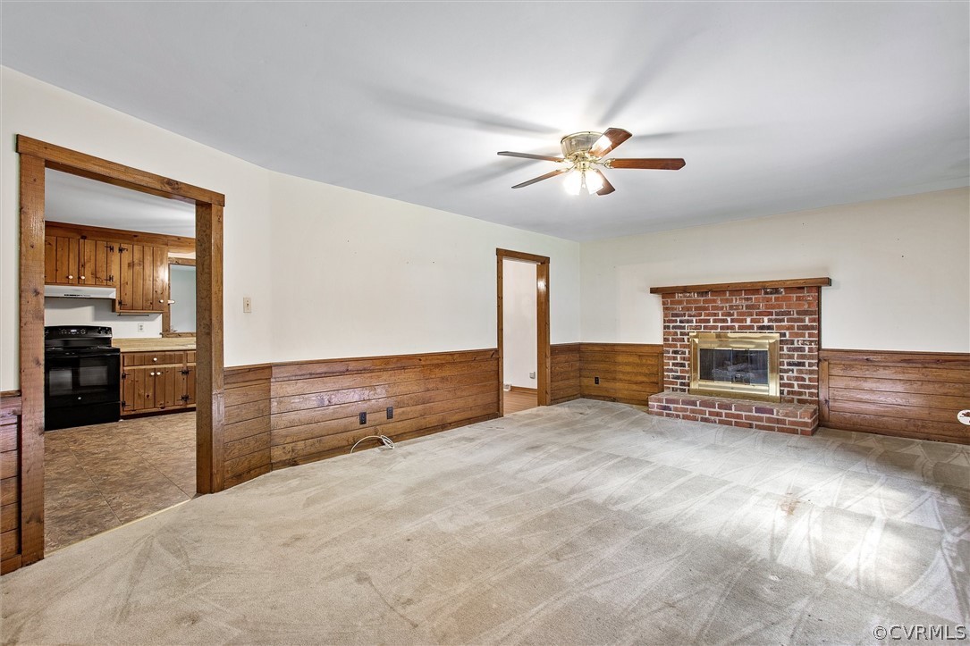 7708 Valencia Road Chesterfield, VA 23832 - Photo 4 of 21 a view of workspace with fireplace and ceiling fan