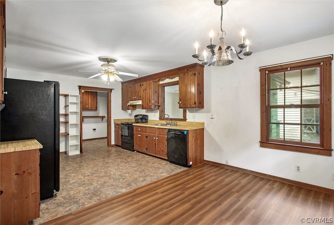 7708 Valencia Road Chesterfield, VA 23832 - Photo 6 of 21 a view of a kitchen with a sink and microwave