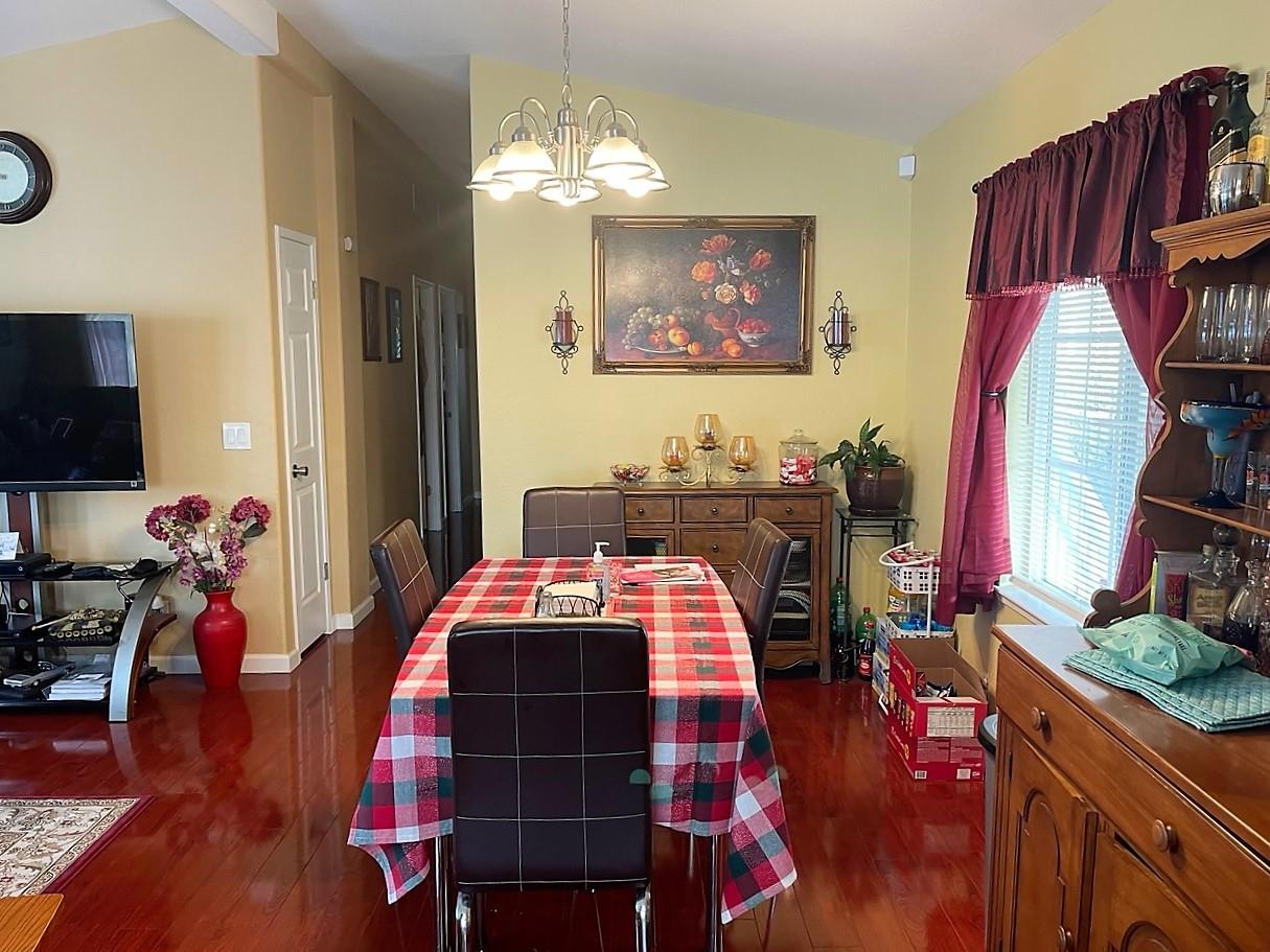 6130 Monterey Road, Unit 289 San Jose, CA 95138 - Photo 2 of 17 a bedroom with bed and wooden floor