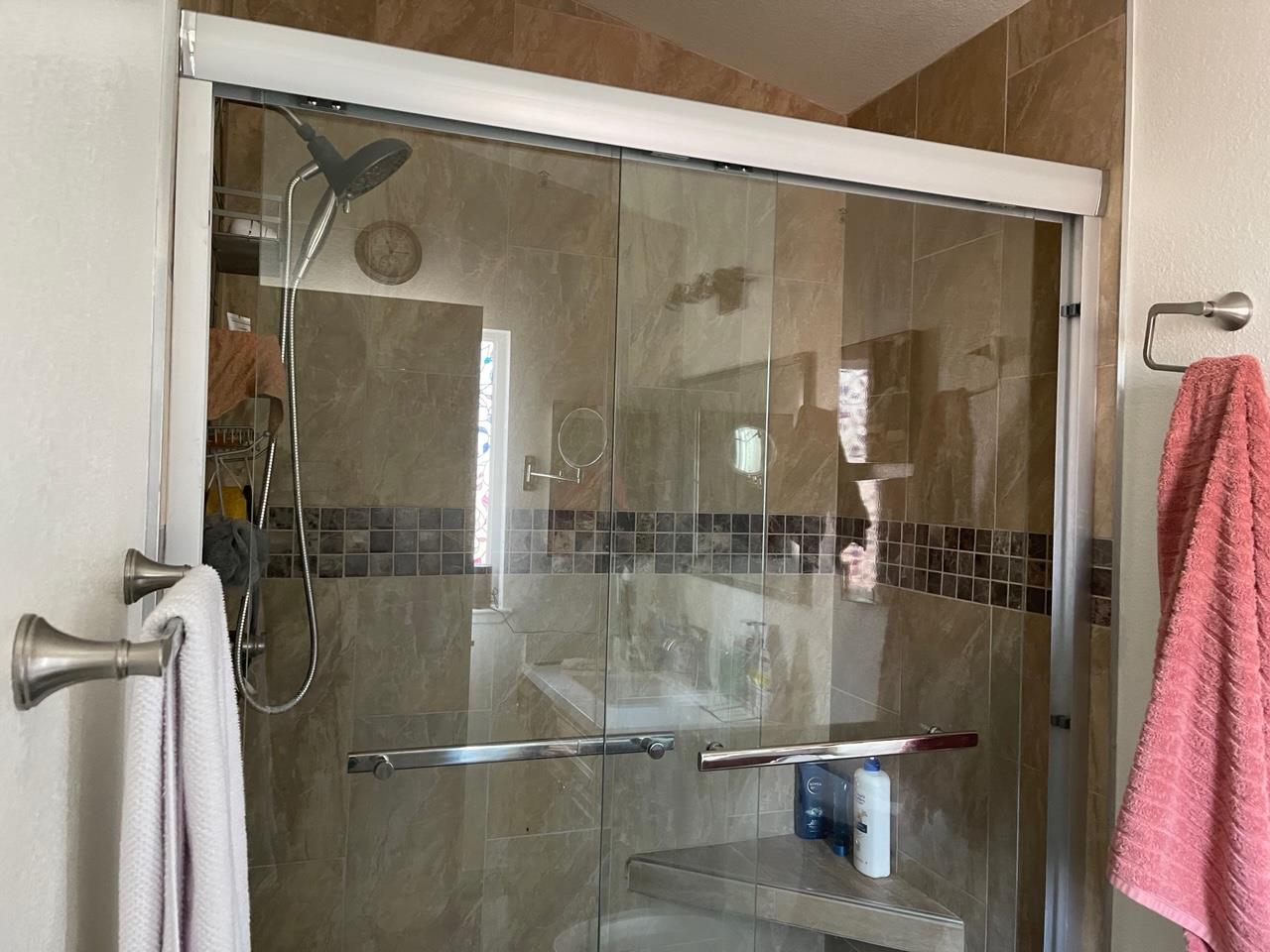 6130 Monterey Road, Unit 289 San Jose, CA 95138 - Photo 12 of 17 a bathroom with a glass shower door