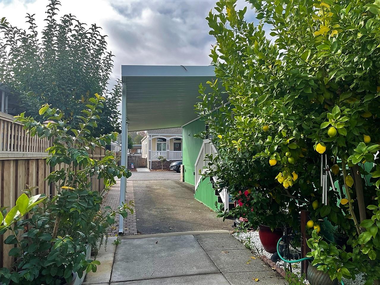 6130 Monterey Road, Unit 289 San Jose, CA 95138 - Photo 17 of 17 a view of a house with a flower garden