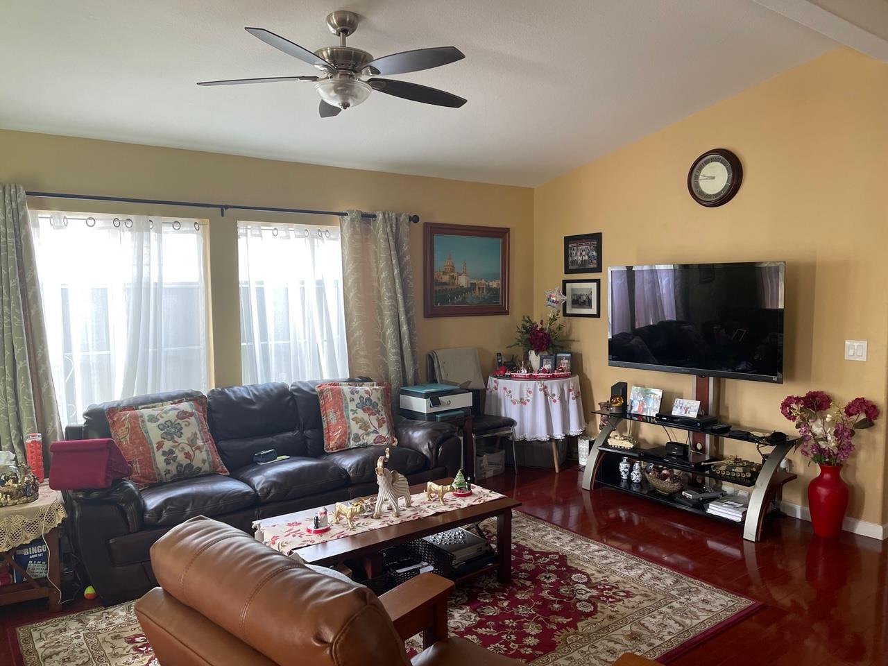 6130 Monterey Road, Unit 289 San Jose, CA 95138 - Photo 5 of 17 a living room with furniture and a flat screen tv