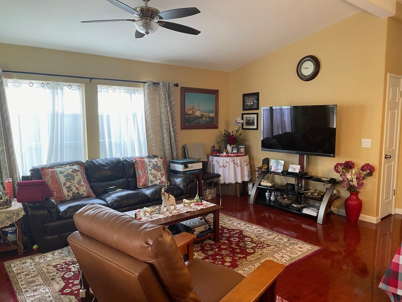 6130 Monterey Road, Unit 289 San Jose, CA 95138 - Photo 6 of 17 a living room with furniture and a flat screen tv