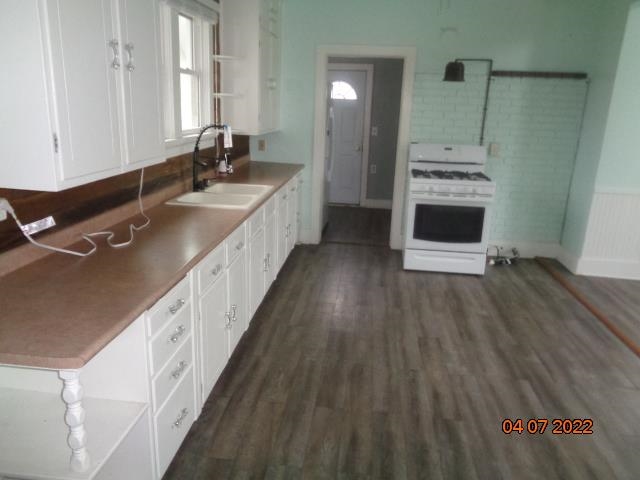 401 2nd Street Kings, IL 61068 - Photo 11 of 17 a large white kitchen with a sink