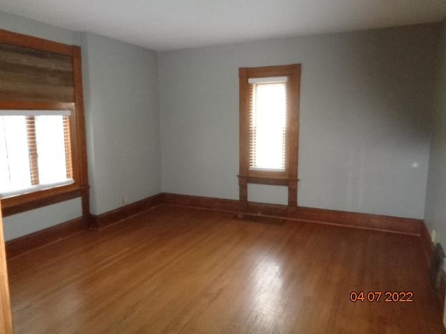 401 2nd Street Kings, IL 61068 - Photo 7 of 17 an empty room with wooden floor and windows