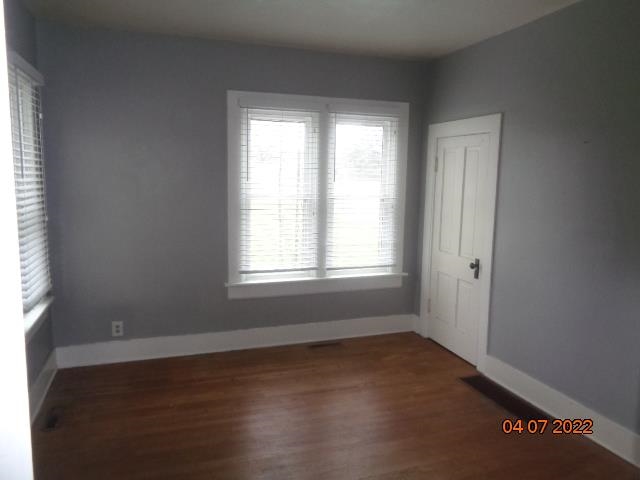 401 2nd Street Kings, IL 61068 - Photo 9 of 17 an empty room with wooden floor and windows