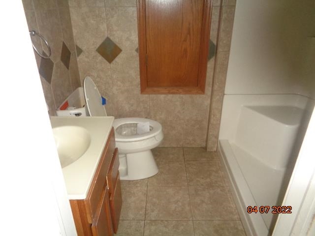 401 2nd Street Kings, IL 61068 - Photo 10 of 17 a bathroom with a sink and a toilet