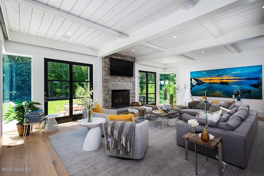 29 Goodsell Hill Road Redding, CT 06896 - Photo 10 of 29 a living room with furniture fireplace and a large window