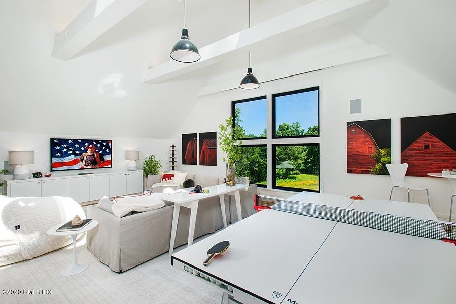 29 Goodsell Hill Road Redding, CT 06896 - Photo 15 of 29 a living room with furniture a window and a flat screen tv