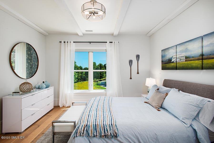 29 Goodsell Hill Road Redding, CT 06896 - Photo 19 of 29 a bedroom with a large bed and a window