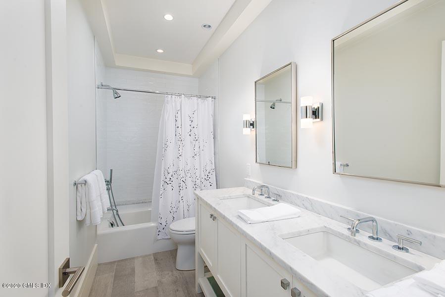 29 Goodsell Hill Road Redding, CT 06896 - Photo 20 of 29 a bathroom with a granite countertop sink toilet and shower