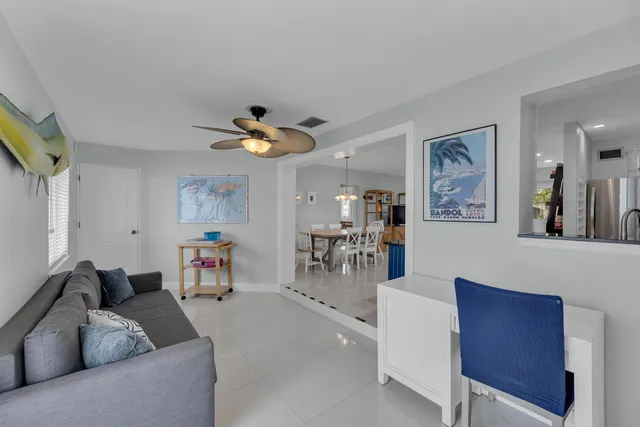 a kitchen with kitchen island granite countertop a table and chairs in it