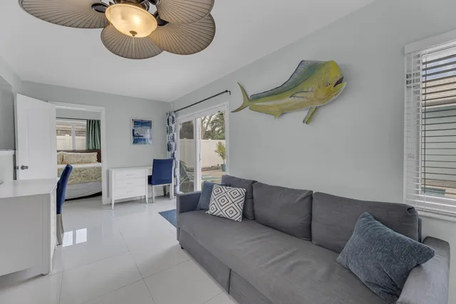 a kitchen with stainless steel appliances granite countertop a kitchen island a table and chairs in it