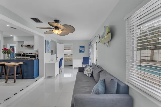 a kitchen with granite countertop a sink cabinets and dining table