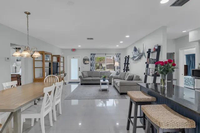 a kitchen with stainless steel appliances granite countertop a stove and cabinets