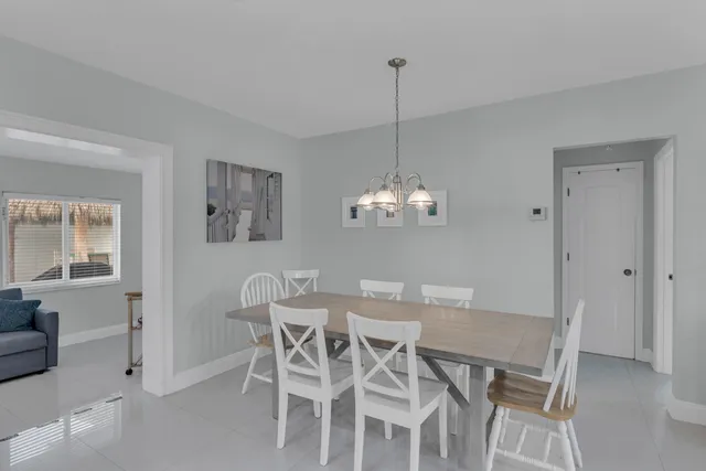 a kitchen with stainless steel appliances granite countertop a refrigerator sink and cabinets