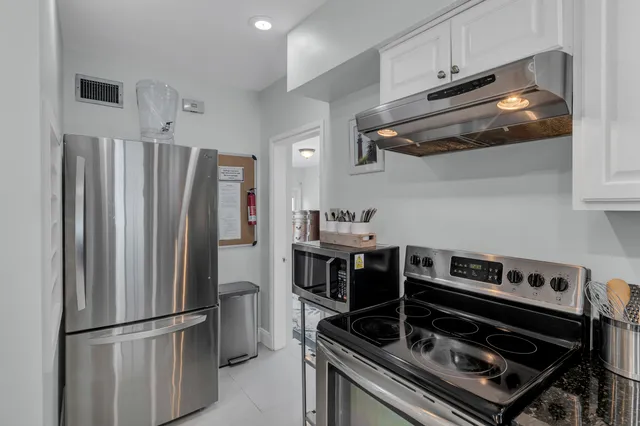 a bedroom with a bed and a mirror