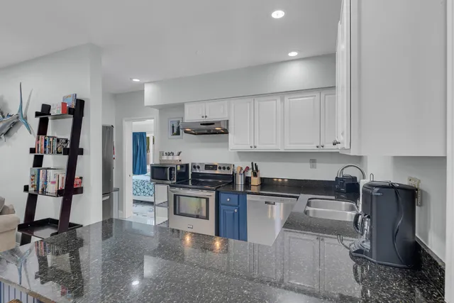 a bedroom with a bed and a lamp on table