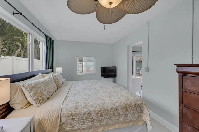 a bedroom with a bed and a chair