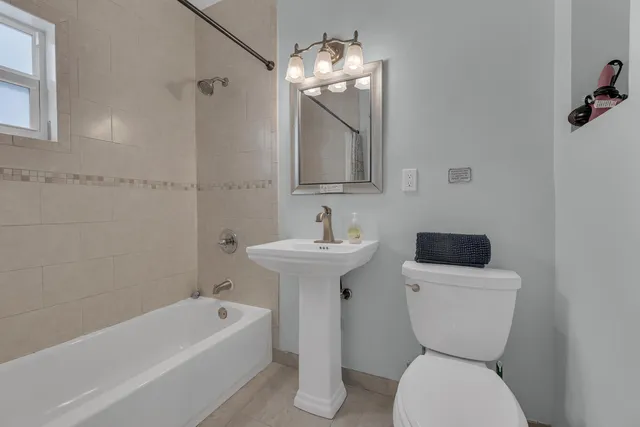 a view of a patio with a table and chairs