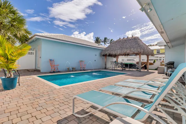 an aerial view of a houses with outdoor space