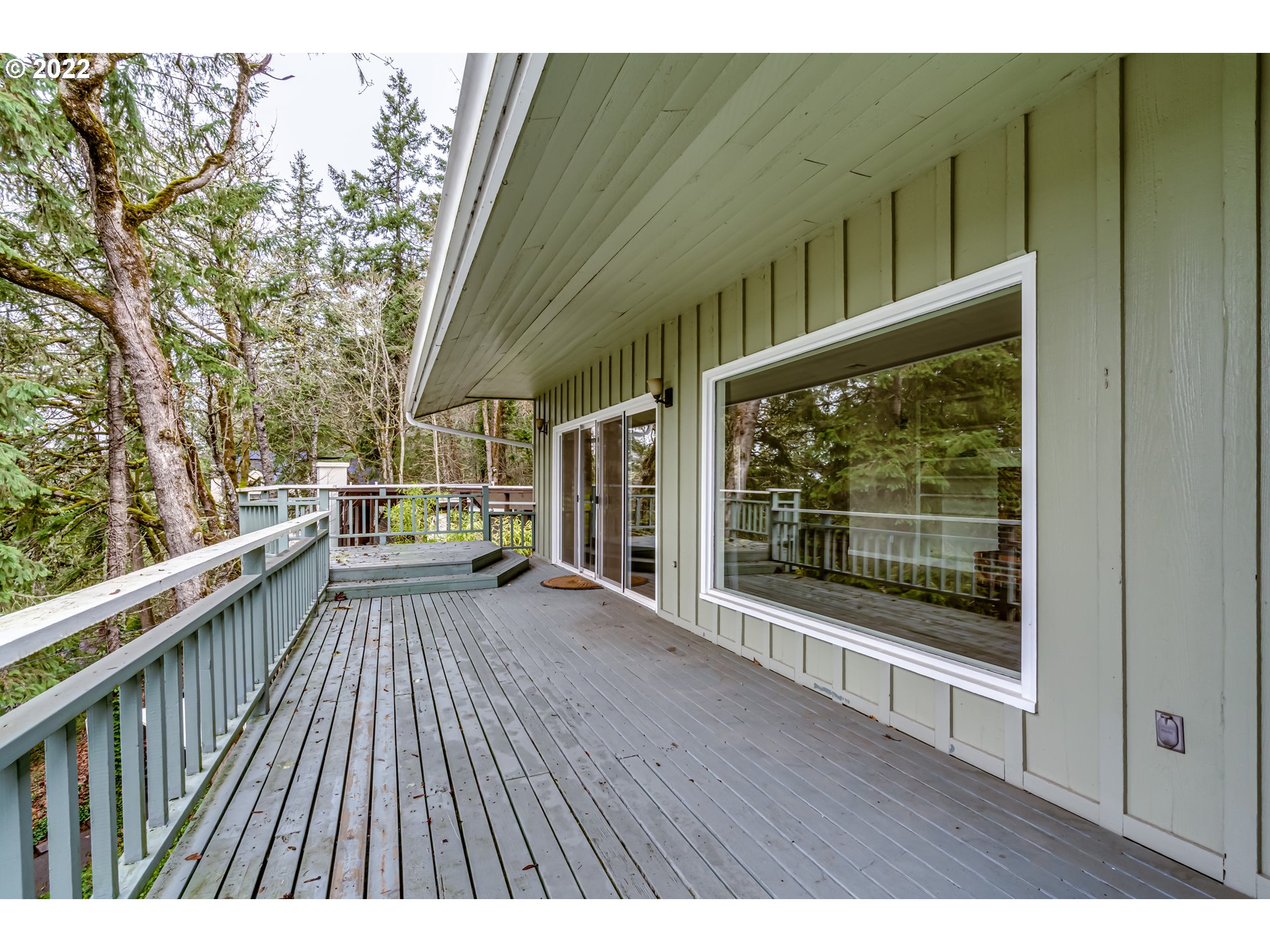 2655 Cresta De Ruta Street Eugene, OR 97403 - Photo 24 of 32 a view of balcony with floor to ceiling windows and wooden floor
