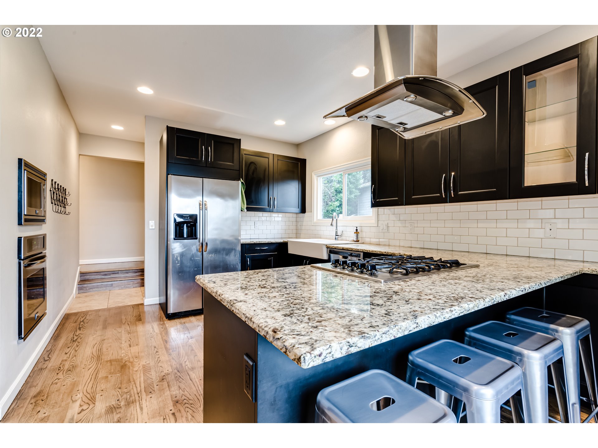 2655 Cresta De Ruta Street Eugene, OR 97403 - Photo 5 of 32 a kitchen with stainless steel appliances granite countertop a sink counter space and cabinets